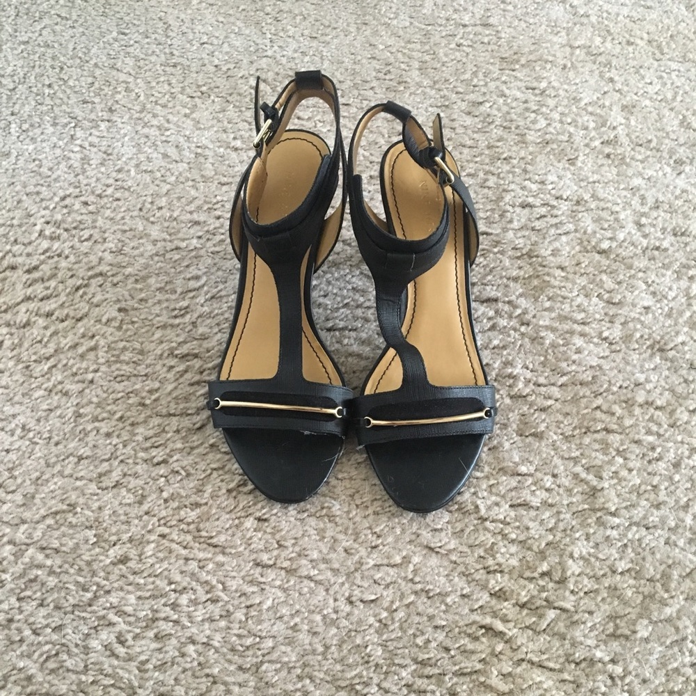 Black heels with gold detail